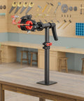Bike Repair Stand Bench Mount in shop setting, showing height adjustment, clamping mechanism, and sturdy base for stable maintenance.