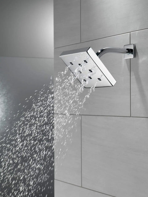 Raincan Shower Head With H2Okinetic Technology Single Setting Metal Shower Head Delivers a Power Drench Spray in use, side view