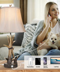 Set Of 2 Rustic Table Lamps For Living Room Farmhouse Antler Resin Nightstand Lamps With USB Charging Ports shown with woman and dog