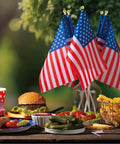 Fourth Of July Flags On Sticks 4x6 Inch Mini American USA Flags for outdoor and indoor decor set on a picnic table with food