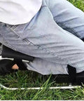 Garden Knee Seat And Kneeler For Easy Yard Work Back Saver Strap On Kneeling Stool Supports Up To 330 Pounds in use