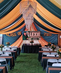 Event tent featuring a Four Tier Large Wedding Chandelier With Faux Crystal Iridescent Beaded Swag, 24 Inch Wide By 36 Inch Long.