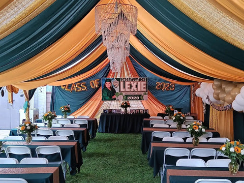 Event tent featuring a Four Tier Large Wedding Chandelier With Faux Crystal Iridescent Beaded Swag, 24 Inch Wide By 36 Inch Long.