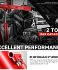 Two Ton Hydraulic Engine Hoist with folding arm lifting an engine in a garage, featuring maximum 2 ton capacity.