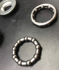 Rock Solid 2 Inch Cup Bottom Bracket Set For One-Piece Cranks Bearings Included Steel Silver close-up view of bearings