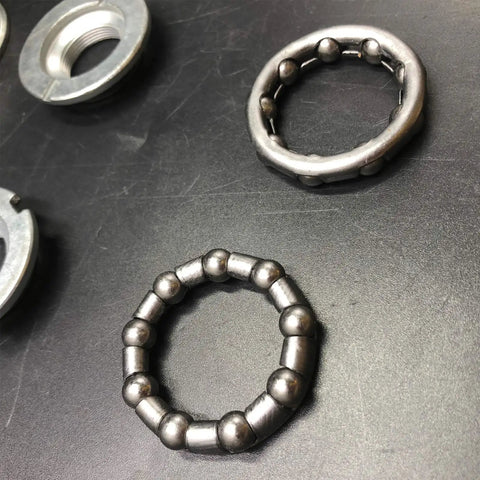 Rock Solid 2 Inch Cup Bottom Bracket Set For One-Piece Cranks Bearings Included Steel Silver close-up view of bearings