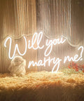 Will You Marry Me Neon Sign For Proposals And Weddings, 25 By 15 Inches, Warm White LED Lights on Wooden Wall