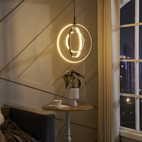 Black Modern 3 Ring Dimmable Pendant Chandelier for Dining Room, Kitchen Island, and Living Room, lit near window.