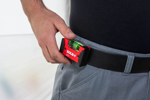 Sola Spirit Level Compact Go! Clip, 0 being held on a belt, showing its compact size and robust design.