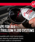 Automatic Transmission Fluid Treatment Scrapes Gritty Sludge To Keep Shifts Snappy And Smooth While Safely Dissolving Hardened Varnish Buildup From Valve Bodies In 16 Oz Bottle being poured into funnel.