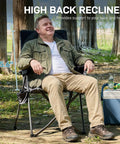 Man relaxing on Lightweight Folding Recliner Chair For Adults With 4 Position Adjustable Back Portable Lawn Chair in wooded area.