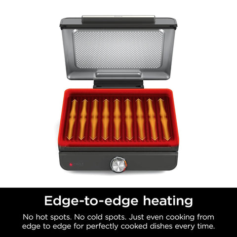 Open view of electric griddle and indoor grill with interchangeable plates for grilling and griddling sear steaks burgers salmon and veggies at up to 500 F nonstick surface dishwasher safe 14 inch cooking surface and even heating.