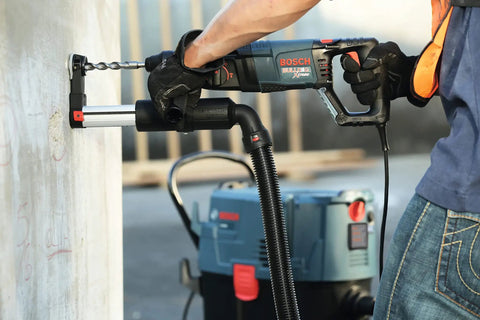 Worker using Two Cutter Head Three Quarter Inch By Twenty Four Inch SDS Plus Bulldog Rotary Hammer Bit for fast drilling into concrete