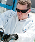 Worker wearing V40 Hellraiser Safety Eyewear With Sunglass Style Frame And Lightweight Flexible Design, ANSI Z87.1 Plus Certified