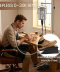 Man using Beast 1200W Flex Shaft Rotary Tool With 30000 RPM Variable Speed for wood carving with foot pedal in workshop