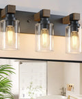 Give Your Mirror Space A Major Glow Up With This Three Bulb Bathroom Vanity Light In Matte Black And Raw Wood Grain Secured By Rock Solid Steel Mounts For Straight Up Rustic Charm.