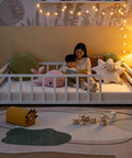 Toddler Floor Bed With Rails And Door, Montessori Low Profile Metal Platform Bed, child reading with parent in cozy room