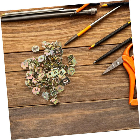 50 Pack Of Straight Up Solid Iron Captive Nut Fasteners With Top Shelf License Plate Screw Retainer Clips on wooden surface.