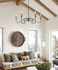 Six Light Farmhouse Chandelier Matte Black Classic Candle Ceiling Fixture in rustic living room setting