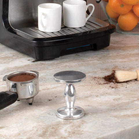 Heavyweight Dual Sided Espresso Tamper Made From Durable Aluminum With 48 Millimeter And 53 Millimeter Ends on kitchen counter