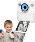 Kids Instant Print Camera With Zero Ink Thermal Printing And Four Paper Rolls For Real Photos On The Go No Ink Cartridges Needed Choose Grayscale Dot Matrix Or Sketch Modes Point And Shoot Family Favorite. child holding kids instant print camera, printing grayscale photo