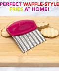 Joie crinkle cutter knife with pink handle and stainless steel wavy blade for slicing potatoes, vegetables and fruits.
