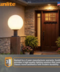 12-Inch Outdoor Post Mount Light Fixture With E26 Socket White Frosted Globe Black Base Weatherproof Wet Rated UL Listed Fits Standard 3-Inch Post Post Not Included Go-To Outdoor Lighting For Porch Patio And Garden Pathways on a porch next to a door.