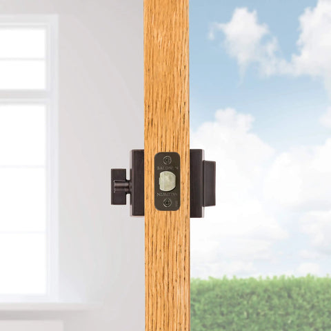 Close-up of Front Door Deadbolt With SmartKey Rekey Technology And Microban Protection in Matte Black on wooden door.