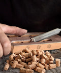 Carpenter Bee Corks 200 Count Kit For Small Holes In Furniture with tapered plugs being placed into wooden surface for repair.