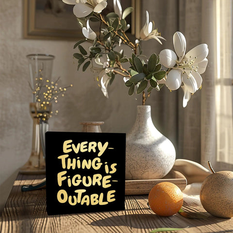 Everything Is Figure Outable Wooden Box Sign In Black Gold Style Motivational Office Decor on Table with Vase and Oranges