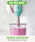 No Sweat 500 Watt Immersion Hand Blender With Knockout Stainless Steel Blades and Whisk Attachment blending pink smoothie in glass.