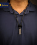 Person wearing Ceramic Striker Fire Starter Necklace With Ferro Rod Toggle And Paracord All In One Bushcraft Emergency Fire Starter Kit.