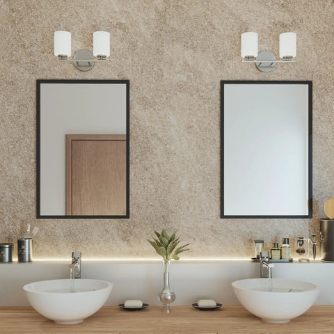 Two Light Etched White Glass Modern Bath Vanity Light In Brushed Nickel Finish, Cord Hung LED Pendant Style above mirrors.