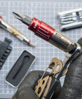 Close-up of Pocket Size Precision Torque Driver With Mini Indexed Wrench And Variable Torque Control, accessories in background.