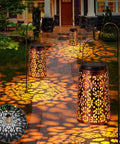 Outdoor Solar Lanterns Hanging Lights Waterproof Metal Decor For Patio Garden Yard Backyard Porch Tree Two Pack With Cool White And Warm Light Modes, illuminating a pathway with intricate light patterns.