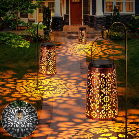 Outdoor Solar Lanterns Hanging Lights Waterproof Metal Decor For Patio Garden Yard Backyard Porch Tree Two Pack With Cool White And Warm Light Modes, illuminating a pathway with intricate light patterns.
