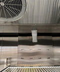 Interior view of Heavy Hitter Commercial Merchandiser Freezer with stainless steel finish and cooling fans.