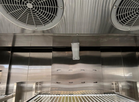 Interior view of Heavy Hitter Commercial Merchandiser Freezer with stainless steel finish and cooling fans.