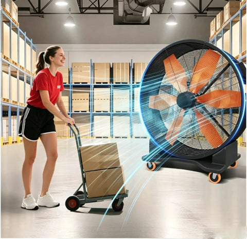 Real Deal High Capacity Industrial Warehouse Floor Fan Featuring Slick Aerodynamic Blades For Far Reaching Cool Breeze Built Tough Anti Tip Base And Smooth Casters with worker and cart in warehouse.