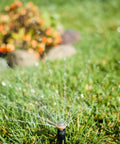 High Efficiency Pro Rotary Sprinkler With Built In Regulator Delivers Constant 30 PSI spraying water on lawn