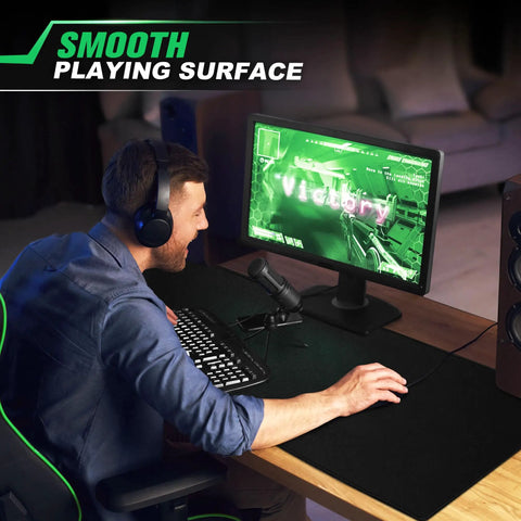 Gamer using Huge 46 By 17 Inch XXL Thick Gaming Mouse Pad For Gamers Extra Large Extended Desk Mat With Smooth Surface And Non Slip Base Black Color For Wide Mouse Movements And Keyboard Setup.