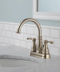 Porter Two Handle Centerset Bathroom Faucet In Brushed Nickel With Mid Arc Spout 7 Inch High, 5 Inch Reach, Easy Grip Lever Handles