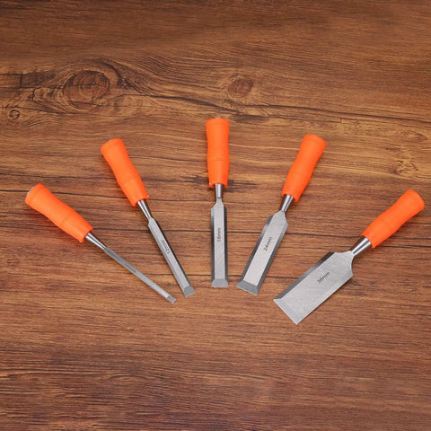 A set of five wood chisels with orange grips displayed on a wooden surface, including the 5 16th Inch Carbon Steel Beveled Edge Wood Chisel With Plastic Non Slip Handle Orange Grip For Woodworking Carving And DIY Projects Built Tough For Real Woodworkers And Carvers Durable Flat Chisel For Precise Cuts.