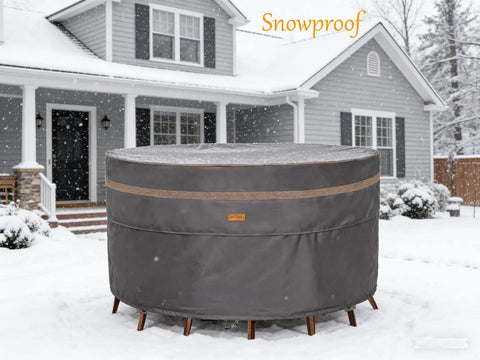 Heavy Duty Round Patio Table And Chair Cover 84 Inch Diameter 28 Inch High Waterproof UV Resistant Dark Grey Fits 84 Inch Tables Or 47 Inch Tables With Chairs Outdoor Weatherproof Protection in a snowy setting
