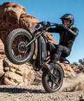 Premium Rugged Fat Tire Electric Bike For Adults Featuring Built To Last 48V 25Ah Removable Battery Gutsy 1500W Peak Motor Gravel Ready Commuter E Bicycle riding on rocky terrain.