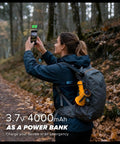 Person hiking with 2 Pack Rechargeable Spotlight Flashlights 1,000,000 Lumen Beast Bright IP67 Waterproof Handheld Search Light clipped to backpack.