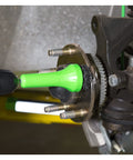 Drill Powered Brake Hub Resurfacing Tool with pads in use on car wheel hub, removing rust for improved rotor flush and smoother braking.
