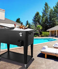 Portable Rolling Cooler Cart On Wheels With Shelves For Outdoor Parties Patio Deck Backyard Bbq Bar Beverage Service 80 Quart Ice Chest With Bottle Opener And Locking Casters Black next to pool.