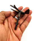 Person holding one of the Vintage Cast Iron Closet Door Pull Handles in Bronze Finish with Delicate Bird Design Set of 2, showing detail.