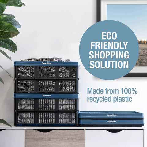 Stacked Foldable 45L Collapsible Utility Crate Heavy Duty Plastic Storage Box With 66 lb Capacity in Obsidian next to a plant.